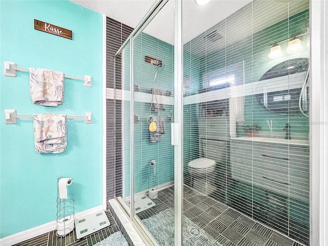 bathroom with tile patterned floors and a shower with shower door