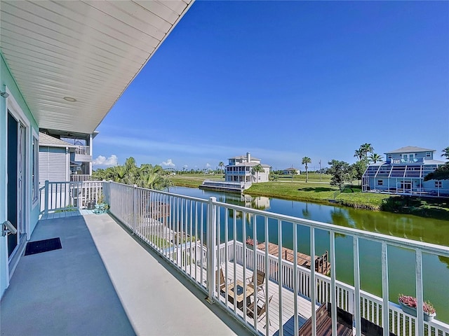 balcony featuring a water view