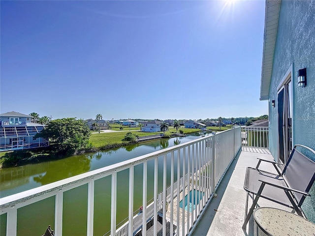 balcony featuring a water view