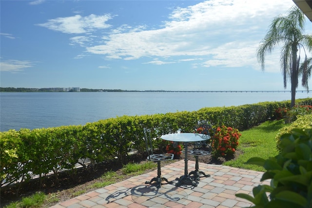 view of patio with a water view