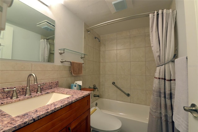 full bathroom featuring shower / bath combination with curtain, backsplash, toilet, vanity, and tile walls