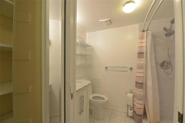 bathroom featuring vanity, tile patterned flooring, a shower with shower curtain, and toilet