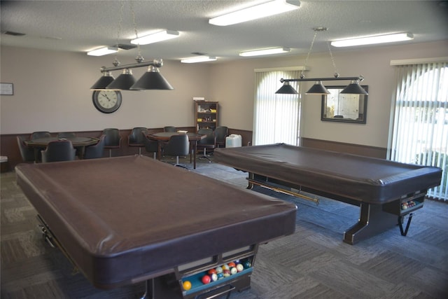 rec room with pool table, a healthy amount of sunlight, and dark carpet