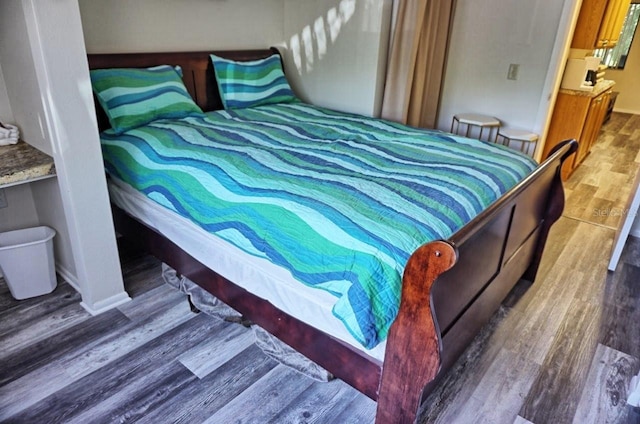 bedroom with wood-type flooring