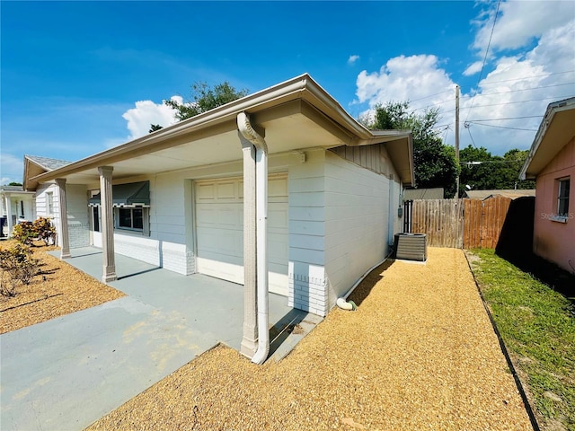 view of side of home featuring a garage