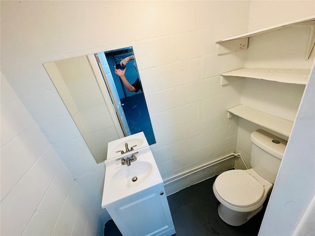 bathroom featuring toilet and vanity