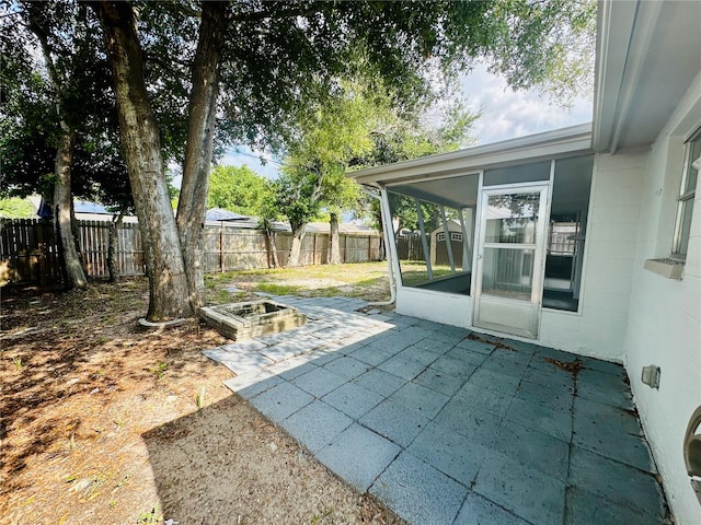 view of yard with a patio area and a sunroom