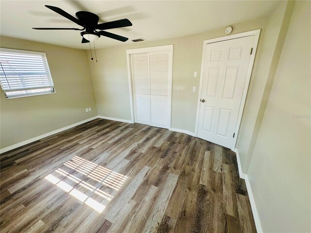 unfurnished bedroom with hardwood / wood-style flooring and ceiling fan