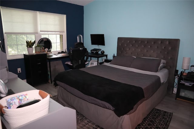 bedroom featuring hardwood / wood-style floors