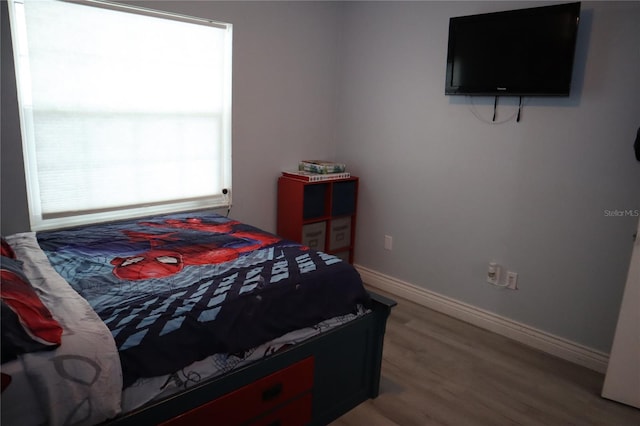 bedroom featuring hardwood / wood-style floors