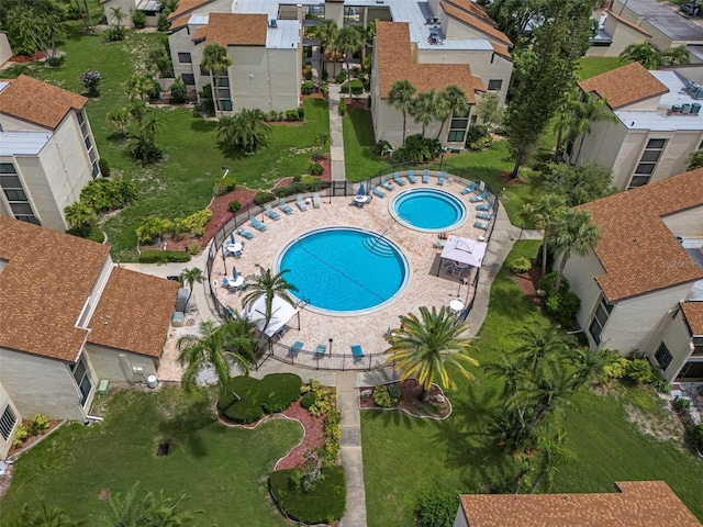 exterior space featuring a community hot tub and a patio