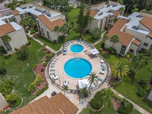 view of swimming pool with a hot tub and a patio area