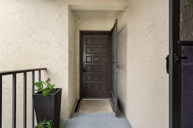 2207 Belleair Rd Unit A32, Clearwater, FL 33764 - property entrance with stucco siding and a balcony