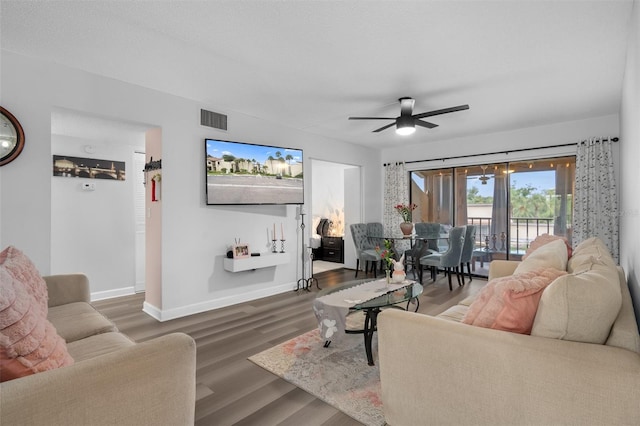 2207 Belleair Rd Unit A32, Clearwater, FL 33764 - living area with baseboards, a ceiling fan, and wood finished floors