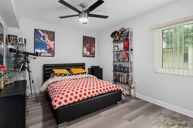 2207 Belleair Rd Unit A32, Clearwater, FL 33764 - bedroom with wood finished floors, baseboards, and ceiling fan