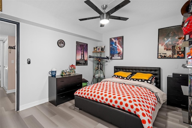 2207 Belleair Rd Unit A32, Clearwater, FL 33764 - bedroom with wood finished floors, ceiling fan, and baseboards