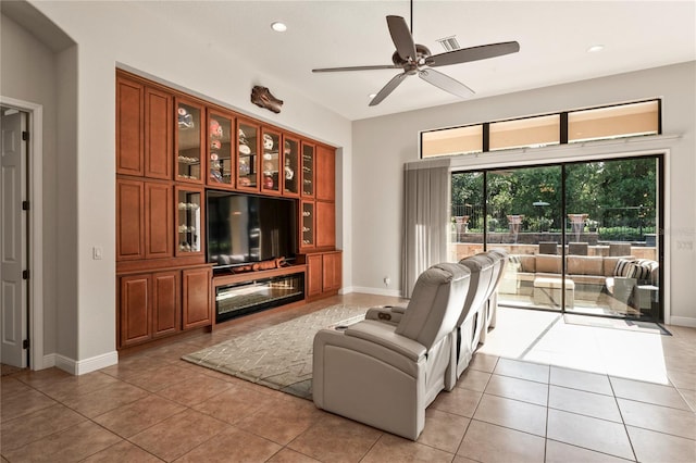 living room with light tile patterned flooring and ceiling fan