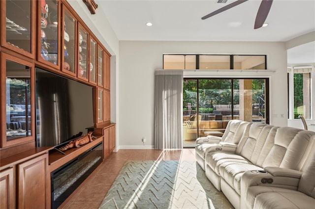 tiled living room featuring ceiling fan