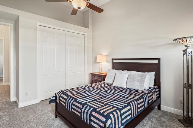 carpeted bedroom featuring ceiling fan and a closet