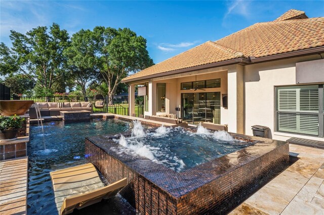 view of pool with pool water feature