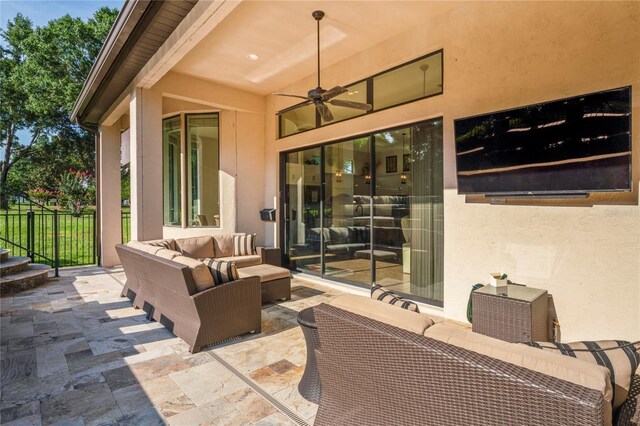 view of patio featuring an outdoor living space and ceiling fan