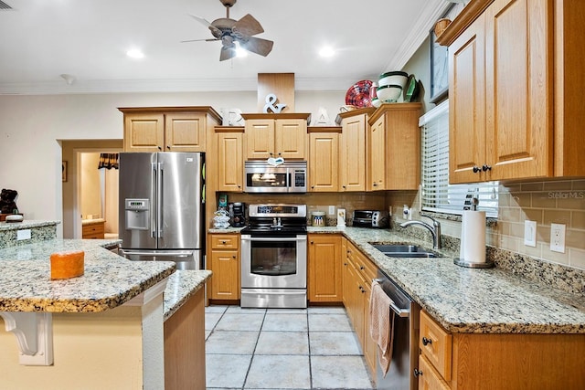 kitchen featuring sink, stainless steel appliances, ornamental molding, and backsplash