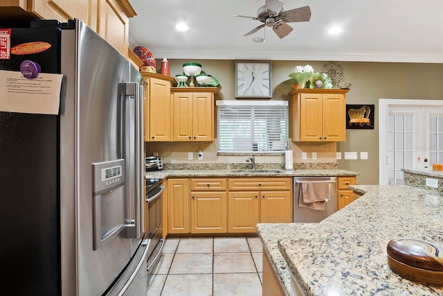 kitchen featuring sink, appliances with stainless steel finishes, ornamental molding, and tasteful backsplash