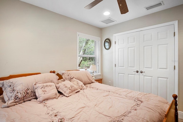 bedroom featuring ceiling fan and a closet