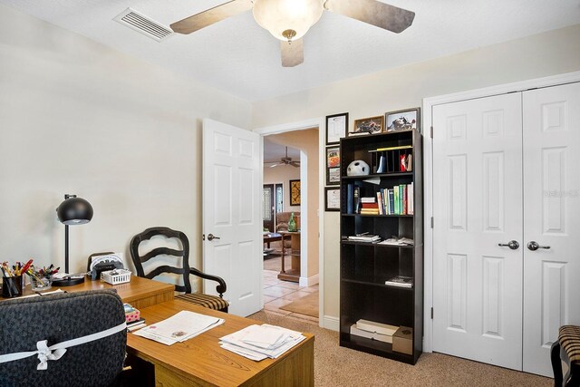 office area featuring ceiling fan and light colored carpet