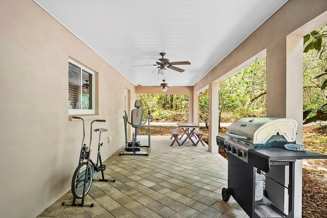 view of patio with grilling area and ceiling fan