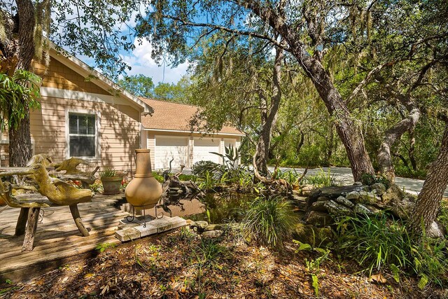 view of yard featuring a garage