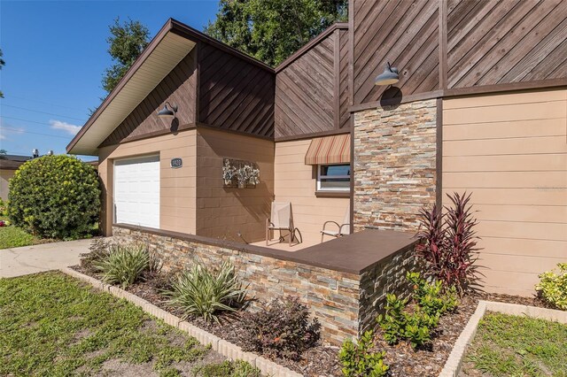 view of property exterior with a garage