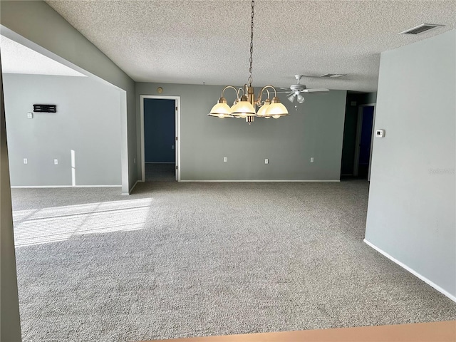 4713 Tiburon Dr, New Port Richey, FL 34655 - carpeted empty room with a textured ceiling, visible vents, a chandelier, and baseboards