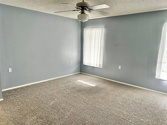 4713 Tiburon Dr, New Port Richey, FL 34655 - carpeted empty room featuring a textured ceiling, ceiling fan, and a wealth of natural light