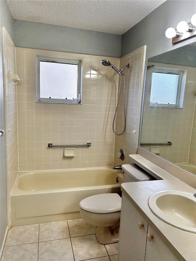 4713 Tiburon Dr, New Port Richey, FL 34655 - bathroom with bathtub / shower combination, tile patterned floors, toilet, vanity, and a textured ceiling