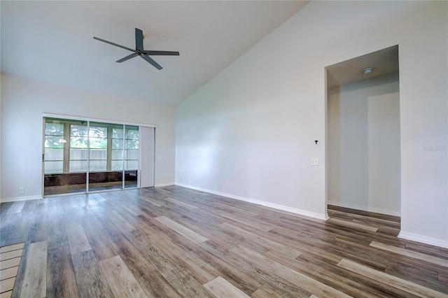 unfurnished living room featuring wood-type flooring, high vaulted ceiling, and ceiling fan