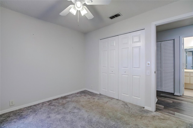 unfurnished bedroom featuring ceiling fan and carpet flooring