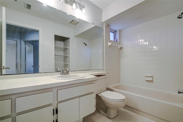 full bathroom with toilet, tile patterned flooring, built in shelves, vanity, and tiled shower / bath