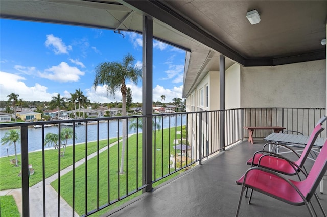 balcony featuring a water view