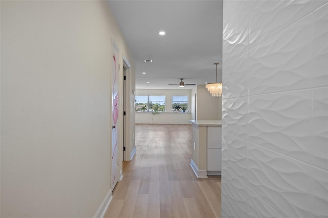 4632 Marine Pkwy Unit 302, New Port Richey, FL 34652 - hall with recessed lighting, light wood-type flooring, baseboards, and a chandelier