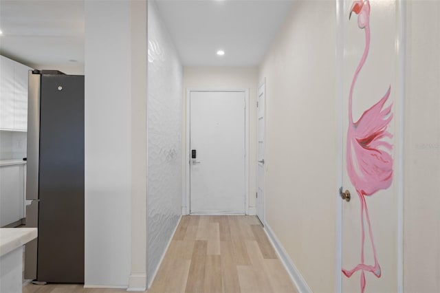 4632 Marine Pkwy Unit 302, New Port Richey, FL 34652 - hall featuring light wood finished floors and recessed lighting
