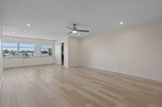 4632 Marine Pkwy Unit 302, New Port Richey, FL 34652 - unfurnished room featuring light wood-type flooring, recessed lighting, ceiling fan, and baseboards