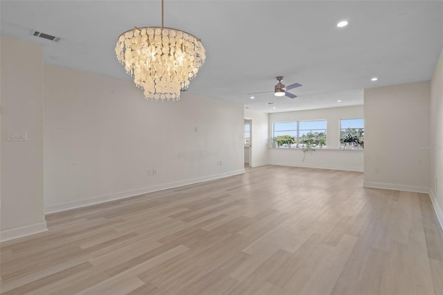 4632 Marine Pkwy Unit 302, New Port Richey, FL 34652 - unfurnished room featuring a ceiling fan, a chandelier, recessed lighting, light wood-type flooring, and baseboards