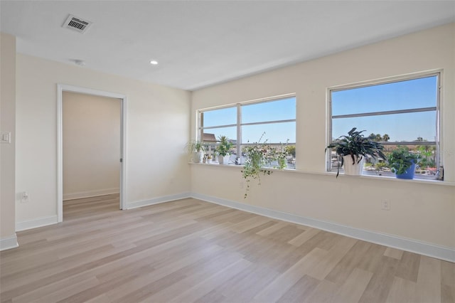 4632 Marine Pkwy Unit 302, New Port Richey, FL 34652 - empty room featuring light wood-style flooring, baseboards, and recessed lighting