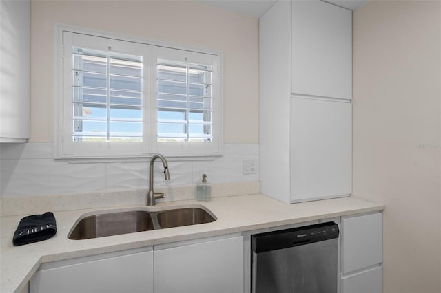 4632 Marine Pkwy Unit 302, New Port Richey, FL 34652 - kitchen with dishwasher, a sink, white cabinetry, and light countertops