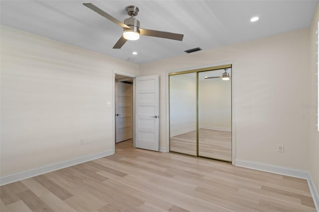 4632 Marine Pkwy Unit 302, New Port Richey, FL 34652 - unfurnished bedroom with light wood-style floors, baseboards, a closet, and recessed lighting