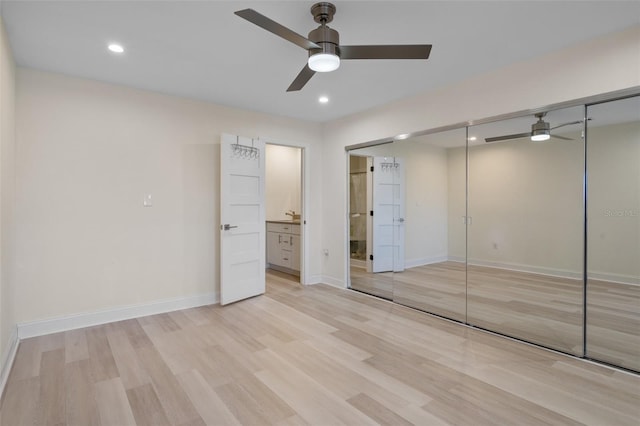 4632 Marine Pkwy Unit 302, New Port Richey, FL 34652 - unfurnished bedroom with light wood-type flooring, ensuite bath, baseboards, recessed lighting, and a closet
