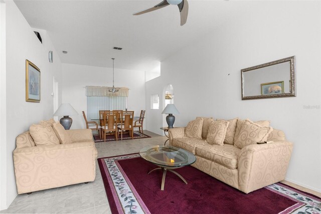 living room featuring light tile patterned floors and ceiling fan