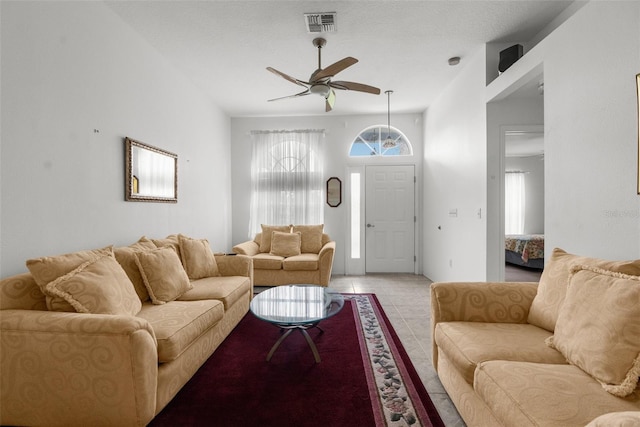 living room with light tile patterned flooring and ceiling fan