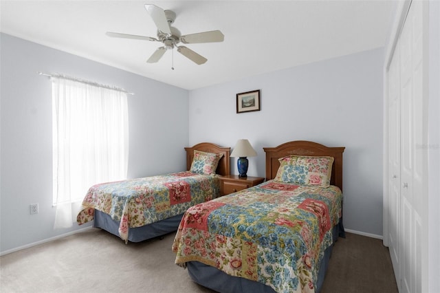 bedroom with ceiling fan, a closet, and light colored carpet